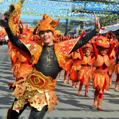 A local festival gives volunteers learning English in the Philippines an opportunity to see more of the local sights and culture. A volunteer studying English in the Philippines attends a local festival to learn about the culture.